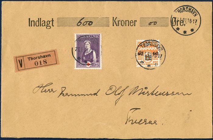 Insured letter with 600 kr. sent from Thorshavn 23 January 1941 to Tveraa. Provisional issue 60/6 and 10+5 øre Queen Aleksandrine tied with THORSHAVN 23.4.1941 16-17, value label “V Thorshavn 018”. Letter sent from Folmer Østergaaard with salary payment to construction workers. 20 øre letter rate plus 50 øre insured fee up to 1000 kr.