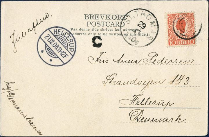 Postcard from Christiansted 29 november 1906 to Hellerup, Denmark. 10 BIT red I. printing King Christian IX tied by 4-ring cancel without dot used at St. Thomas for arriving shipmail from Christiansted and origin mark C large type struck on front, with ST THOMAS 29/11 1906 LAP on front. Instruction to the post JULEAFTEN for delivery Christmas evening and routing instruction BY/GERMAN STEAMER. UPU postcard rate 10 BIT from 15.7.1905 – 31.12.1909.
