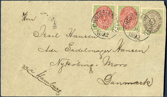 Envelope from Christianssted 13 October 1892 to Nykøbing Mors, Denmark. 7¢ direct rate to Denmark and Germany only with routing instruction VIA HAMBURG, bearing bicolored 5¢ IV and pair 1¢ VII printing tied by mute datestamp with two SS “CHRISTIANSSTED 13/10 1892”, with St. Thomas transit and NYKJØBING I JYLL. 25/11 receiving mark on reverse, envelope opened at right and shortened a bit. VERY FEW 7¢-rate letters recorded with direct ship to Germany or Denmark, the most sought after postal rate from Danish West Indies.