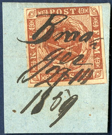 4 sk. dotted spandrels 1854 VI printing on piece, cancelled with ink manuscript ‘Broager 27/11 1859’. Very decorative and a rare cancellation. Broager manuscript cancellation is recorded from 21.8.1858 – 27.11.1859, fold and slight cut in top of the stamp.