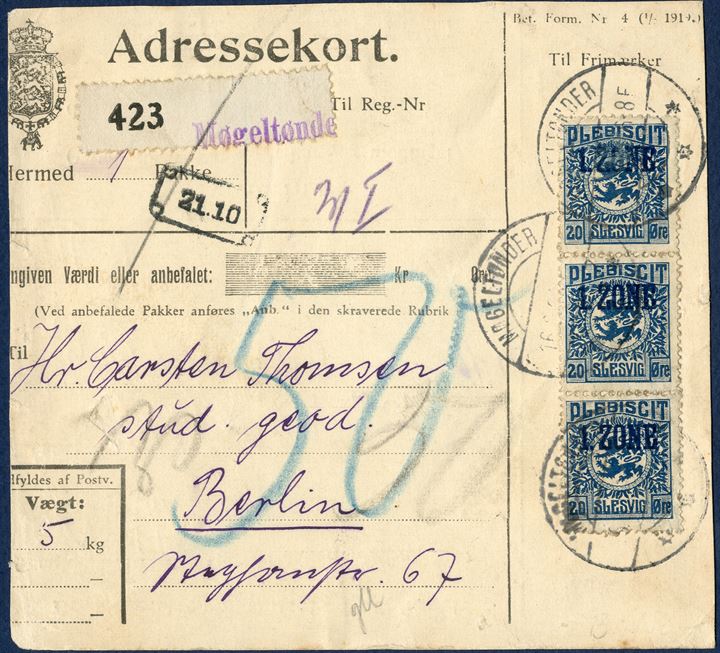 Danish parcel card (cut down) from Møgeltønder 16 June 1920 to Berlin, Germany. Three 20 øre 1. ZONE Plebiscit Slesvig tied by datestamp LØGUMKLOSTER 16.6.20 6-8F. White numbered label ‘423’ and stamped 1-line ‘Møgeltønder’, parcel weighing 5 Kg., parcel fee 0-5 kg 72 øre according to the Danish ‘Post- og Rejsehåndbog von 10.12.1919 s. 54’, underfranked 12 øre and not charged. ‘50’ blue crayon which apparently is customs duties.