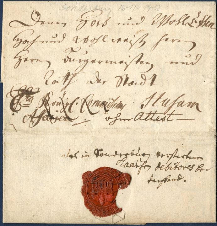 Royal Service letter from Sonderburg 16 November 1738 to Husum with Sonderborg city wax seal. Front with Royal insignia - C6tus Königl. Commission Affairer ·/· and noted – ohne Attest – and crossed out; Königl. Commission Affairer. It is thought, that Husum sent a letter so that Sonderburg had to pay postage since Sonderburg is writing the following inside the letter; 6-tus setzen zu lassen, damit es an porto keine Kostern verursachen möge. Likely only recorded with reference to Royal Insignia letter was not charged. Illustrated in ARGE SCH 163.VII-VIII.