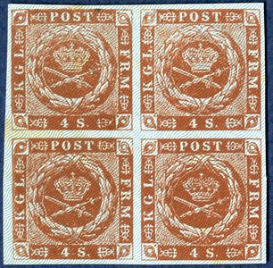 Colour proof of 4 sk. 1854 plate IV, pos. 1-2 / 11-12, block of four without gum and burelage IIb printed in blue colour and dotted spandrels. In the Postal Museum the printing plate has empty spandrels in the lower half sheet of 50 stamps. Plate IV has been used for the last 1854 printing IV delivered from 16 June 1859. It is not known why this plate has had the spandrels removed, but perhaps experiments were made for a new design without spandrels and trials for another burelage colour since the yellow one that were used were sometimes almost invisible.