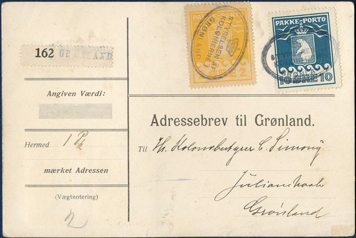 Parcel card to C. Simony, Julianehaab. 1 øre II printing on reverse, 2 øre II printing and 10 øre I printing (AFA 4,5,7) tied by “STYRELSEN AF KOLONIERNE I GRØNLAND” cachet GF14.01. 14 øre franking for 7 kilos, 1 øre per 0,50 kg., registration label type B, no. 162 type b. Sent with “Fox” 10 June 1922 from Copenhagen. 1 øre with some short perforations.